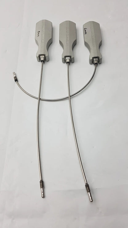 Three silver-colored gore tunneler surgical retractors with engraved markings and flexible metal arms slight curve long