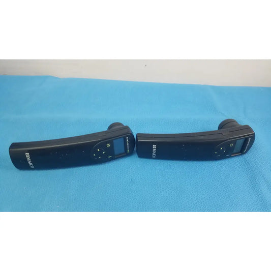 Lot of 2 black d-maco handheld auditory remote controls with digital displays and directional buttons for hearing screening
