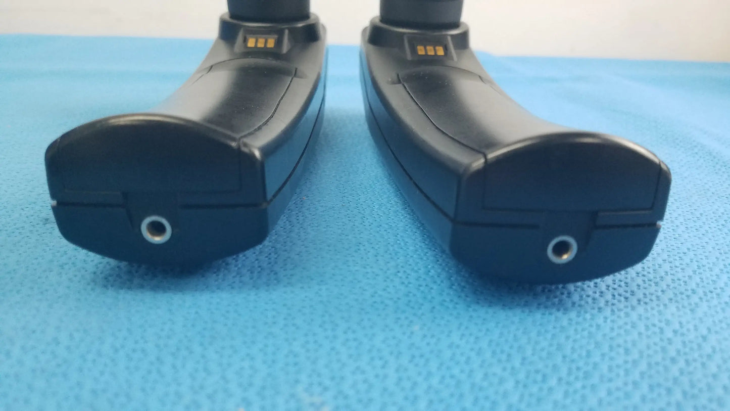 Lot of 2 maico ero scan pro handheld auditory devices with black ergonomic design metallic charging ports and gold contact strips for hearing screening medical equipment