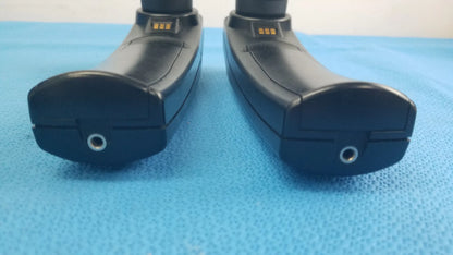 Lot of 2 maico ero scan pro handheld auditory devices with black ergonomic design metallic charging ports and gold contact strips for hearing screening medical equipment