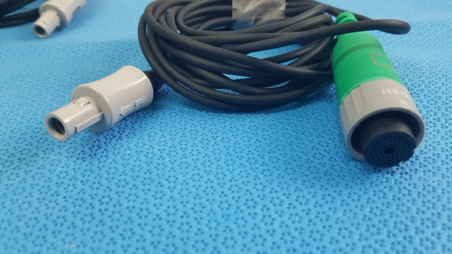 Lot of 2 Stryker catheter connector cables with black coiled cable, white connector, and green gray medical equipment plug
