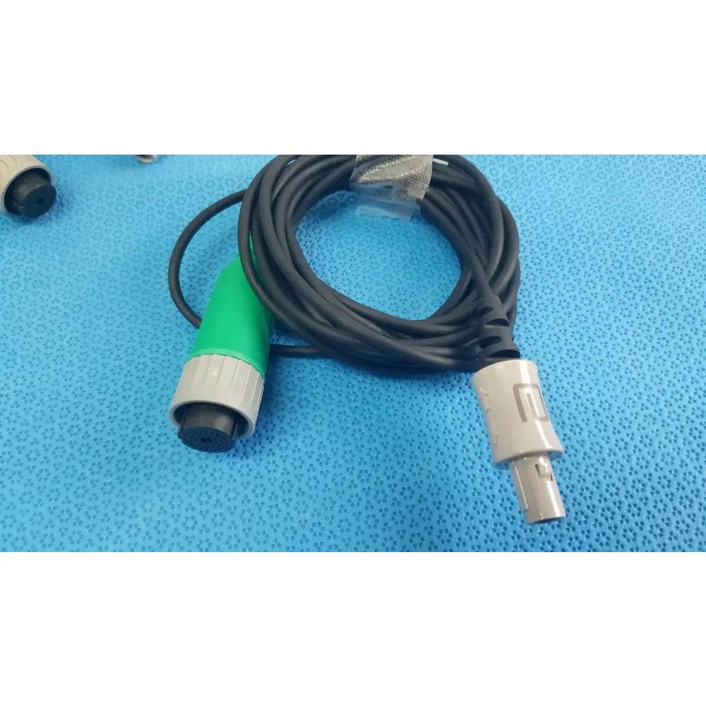 Lot of 2 stryker catheter connector cables black coiled with green gray connector and silver male plug for medical equipment reuse