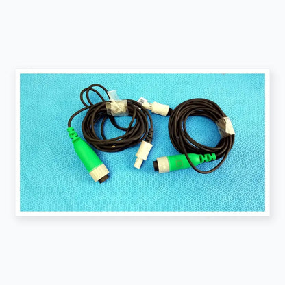 Lot of 2 Stryker catheter connector cables with black coiled cables and green and gray connectors for medical equipment reuse