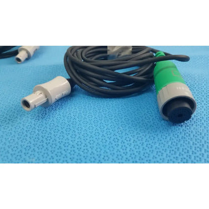 Lot of 2 Stryker catheter connector cables with black coiled cable, white connector, and green gray medical equipment plug
