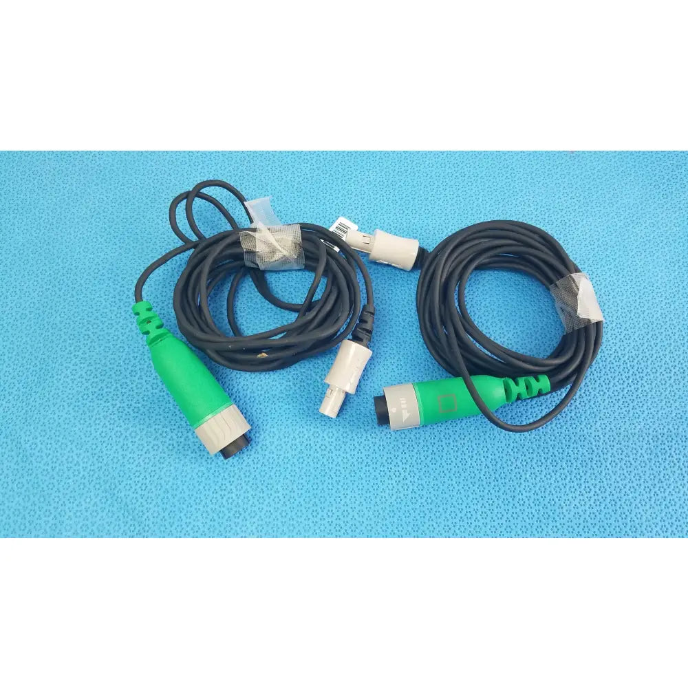 Lot of 2 Stryker catheter connector cables with black coiled cables and green and gray connectors for medical equipment reuse