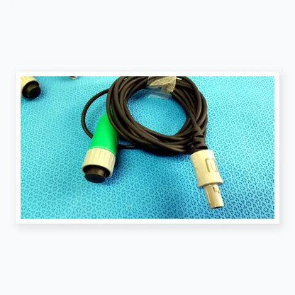 Lot of 2 stryker catheter connector cables black coiled with green gray connector and silver male plug for medical equipment reuse