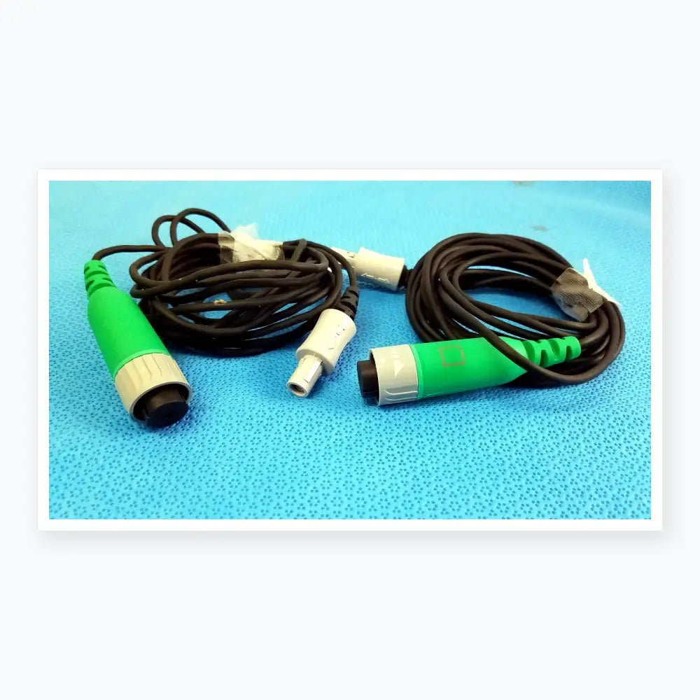 Lot of 2 stryker catheter connector cables with green and gray connectors and black coiled cords for medical equipment reuse