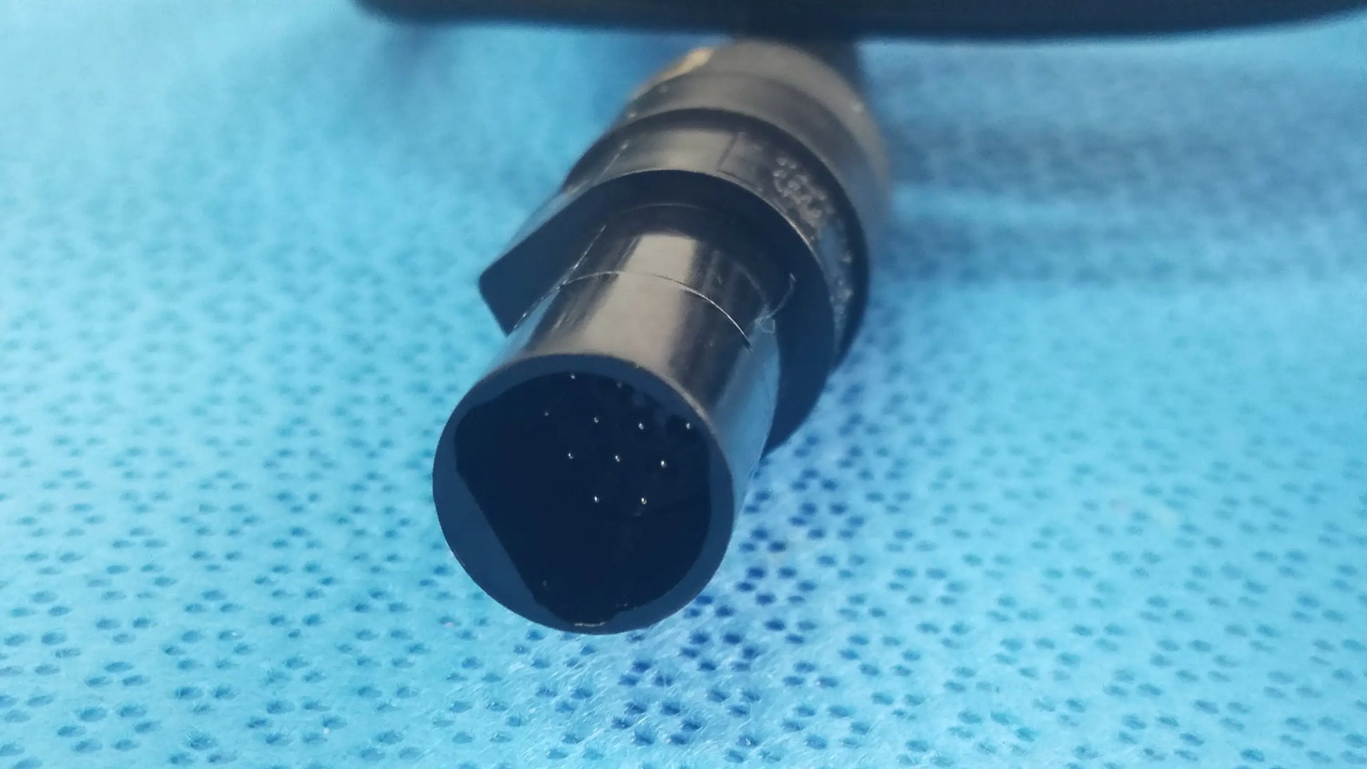 Black plastic hexagonal Ensite X EP system connector cable with octagonal pinholes for reuse medical equipment