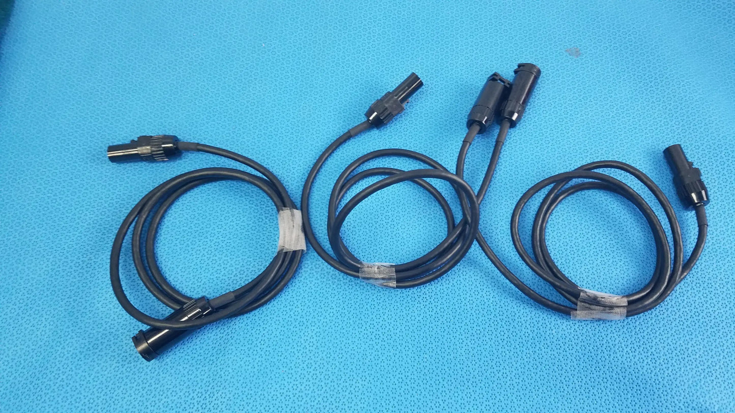 Lot of 3 black mc4 solar connector extension cables with metallic connectors secured by clear plastic ties for photovoltaic use