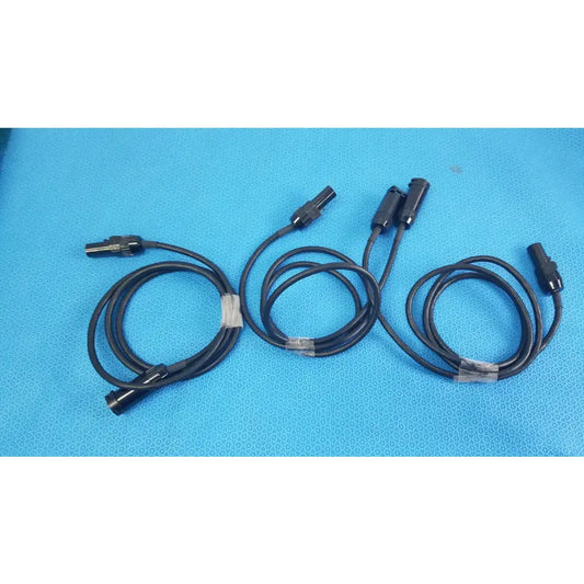 Lot of 3 black mc4 solar connector extension cables with metallic connectors secured by clear plastic ties for photovoltaic use