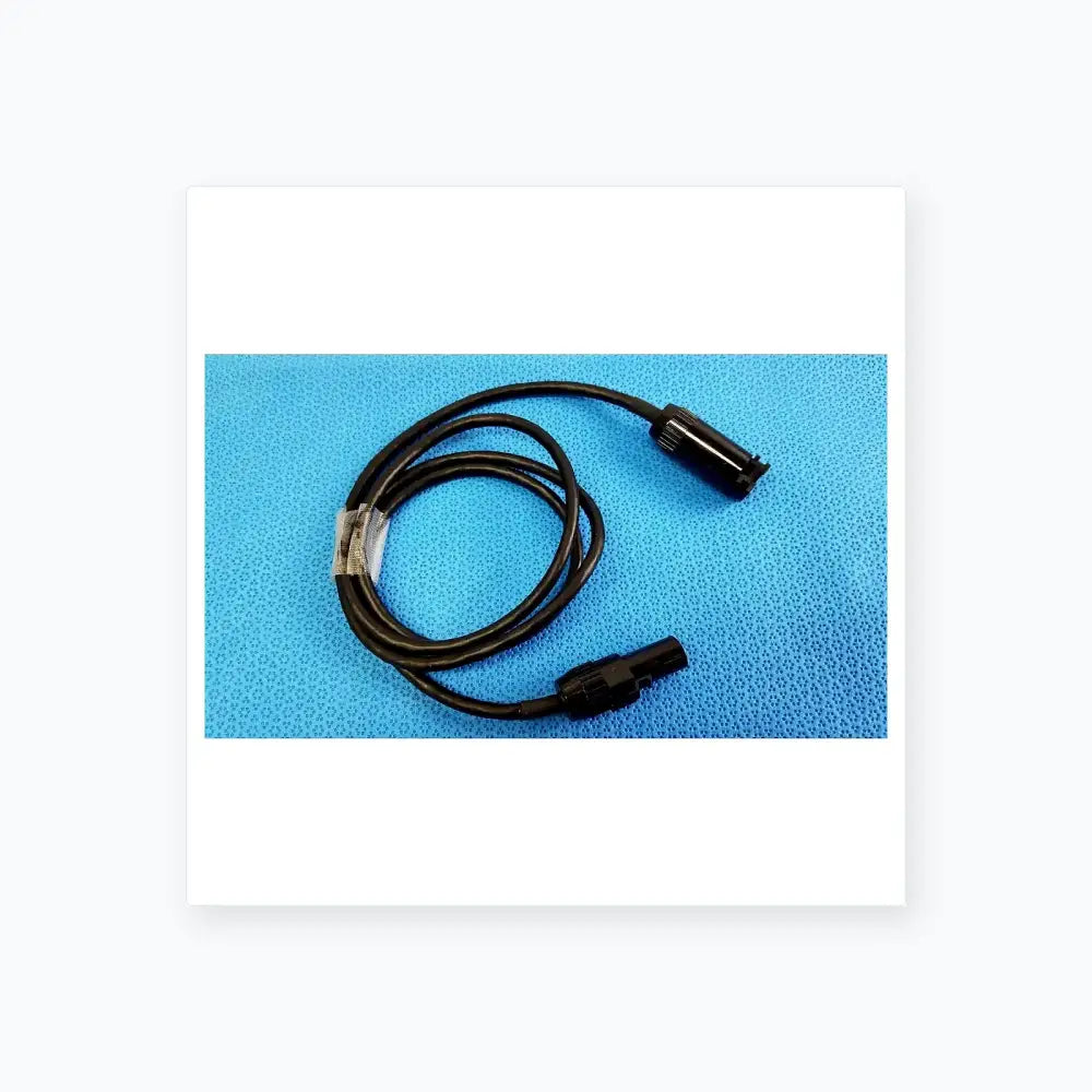 Black coiled mc4 solar connector extension cable with two black plastic connectors for reuse medical equipment applications