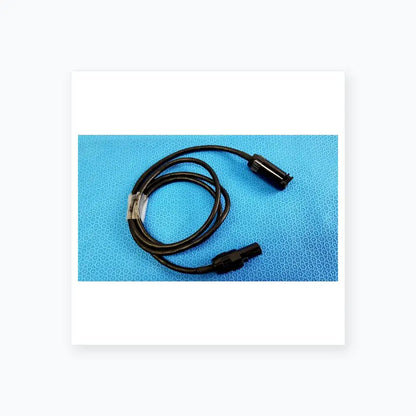 Black coiled mc4 solar connector extension cable with two black plastic connectors for reuse medical equipment applications