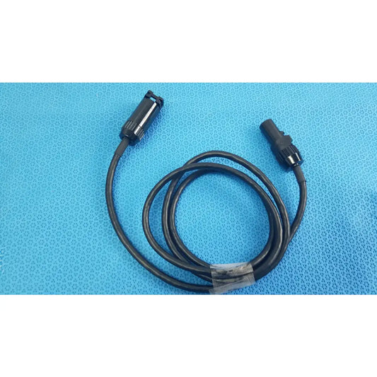 Black coiled mc4 solar connector extension cable with two black plastic connectors including threaded collar for reuse medical equipment