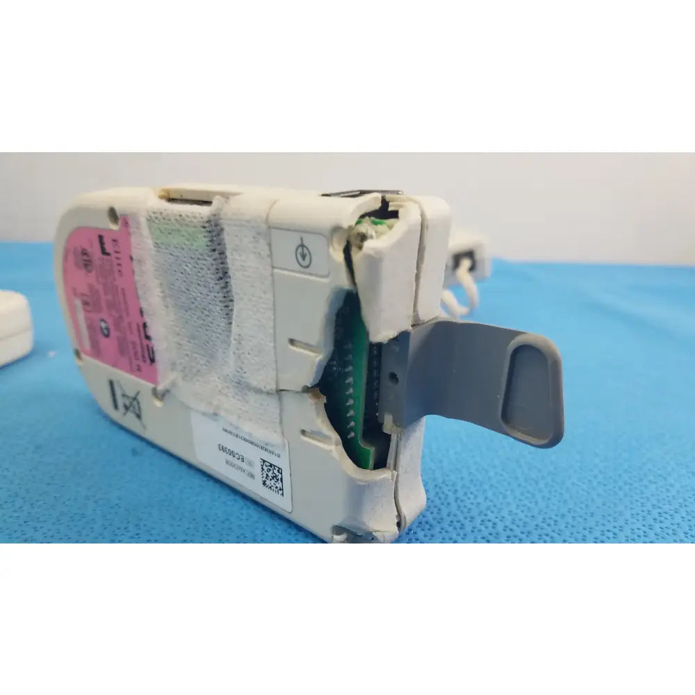 Lot of 3 natus neurology elite 200r handheld dopplers showing white plastic medical equipment with pink label and green circuit board