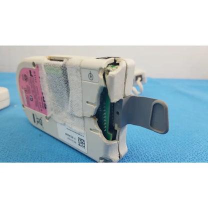 Lot of 3 natus neurology elite 200r handheld dopplers showing white plastic medical equipment with pink label and green circuit board