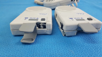 Lot of 3 natus neurology elite 200r handheld dopplers showing white plastic two-way radios with visible internal components