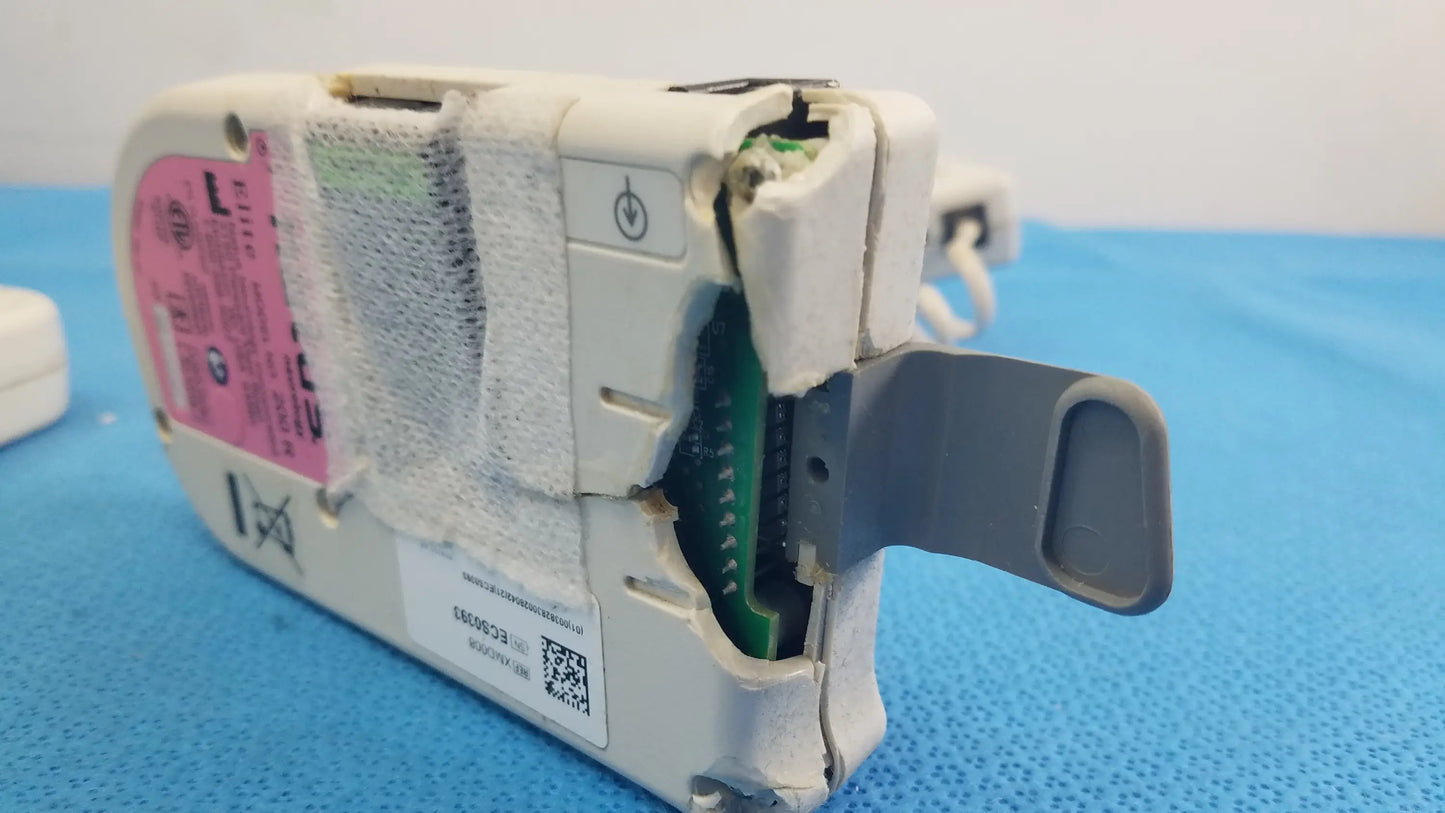 Lot of 3 natus neurology elite 200r handheld dopplers showing white plastic medical equipment with pink label and green circuit board