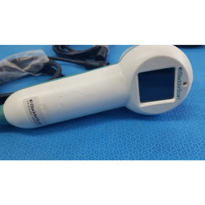 White plastic verathon bladderscan handheld ultrasound device with green accents for reuse medical equipment use