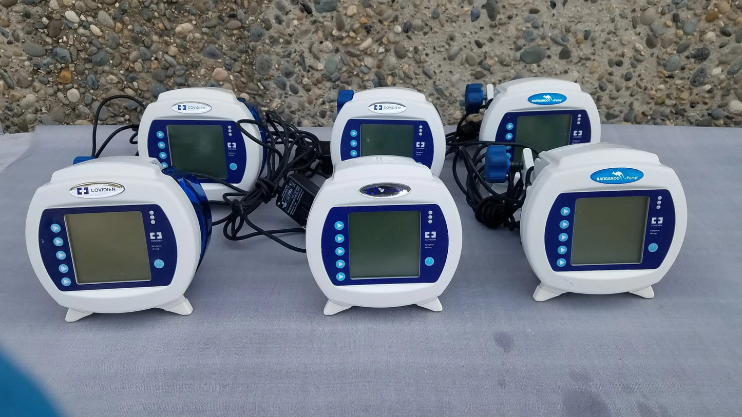 Lot of 6 white and blue covidien enteral feeding pumps with pole clamps compatible kangaroo epump devices