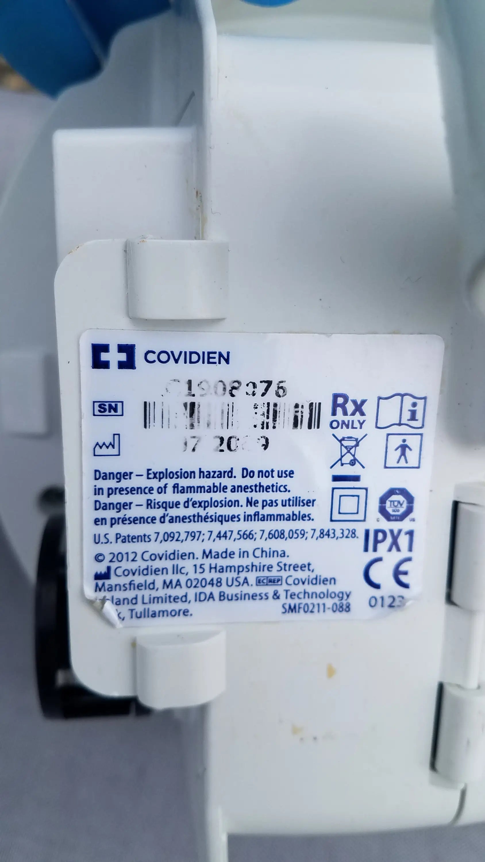 White plastic covidien medical device with regulatory markings and serial number for compatible kangaroo epump enteral feeding