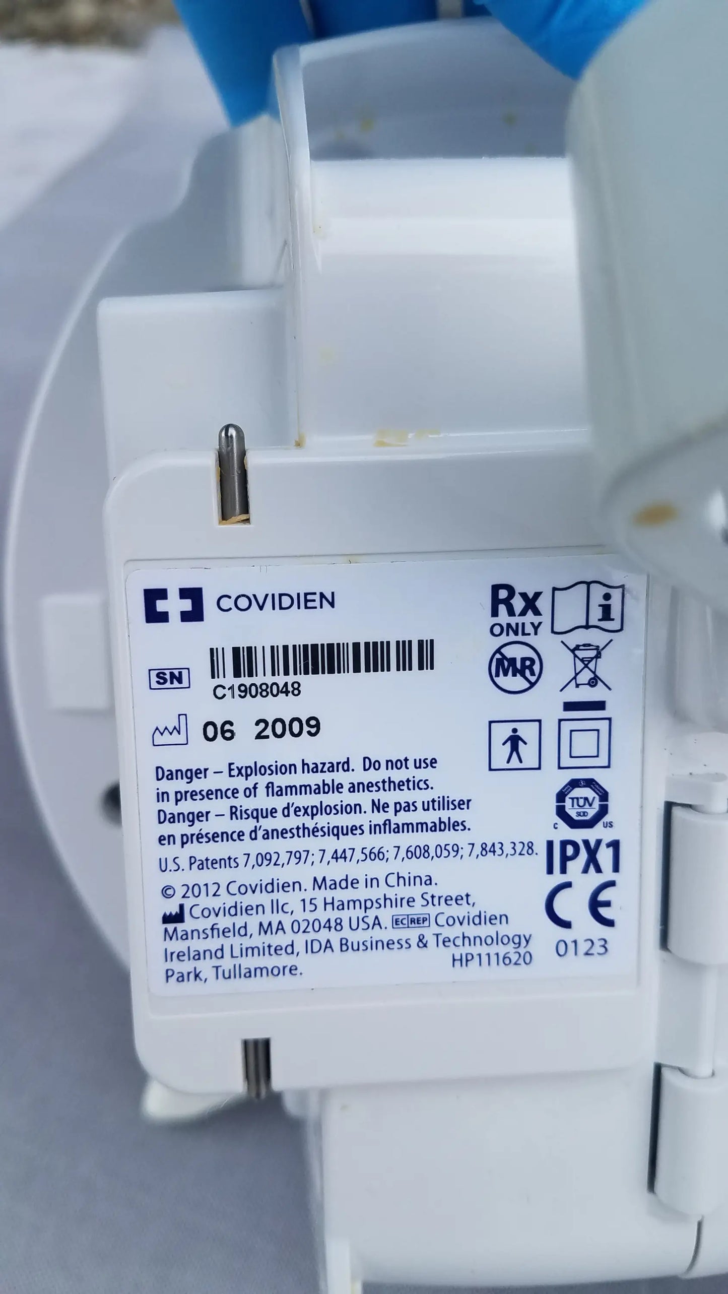 White plastic covidien kangaroo epump enteral feeding pump back with regulatory markings and serial number visible