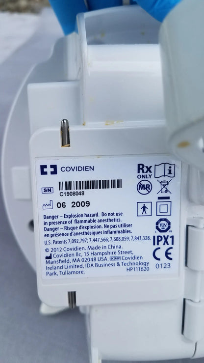 White plastic covidien kangaroo epump enteral feeding pump back with regulatory markings and serial number visible