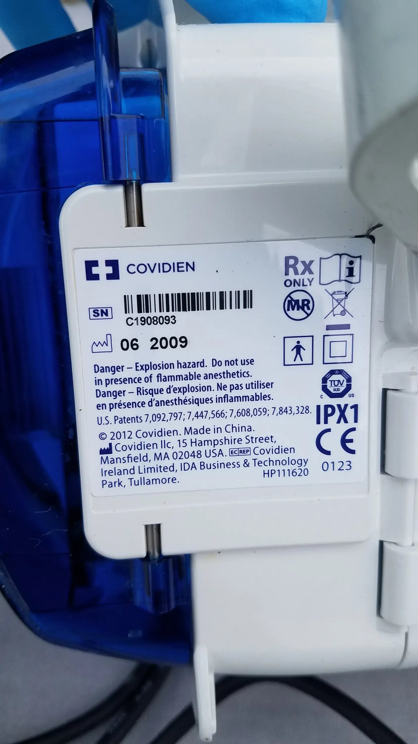 White plastic medical device label with blue translucent casing on compatible kangaroo epump for enteral feeding use