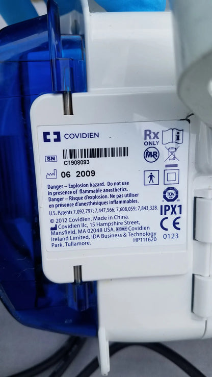 White plastic medical device label with blue translucent casing on compatible kangaroo epump for enteral feeding use