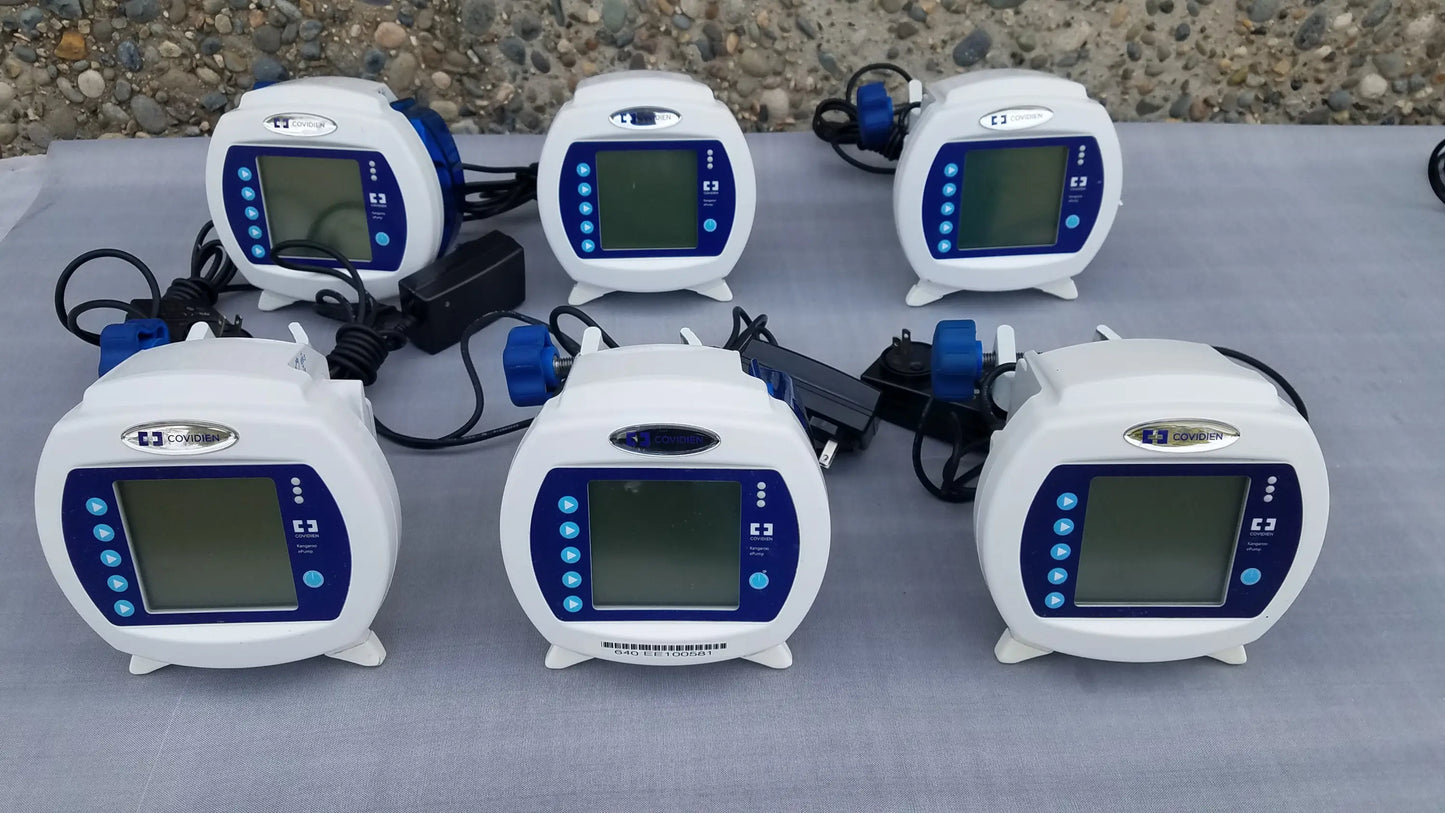 Lot of 6 white and blue covidien kangaroo epump enteral feeding pumps with pole clamps power supplies and cables