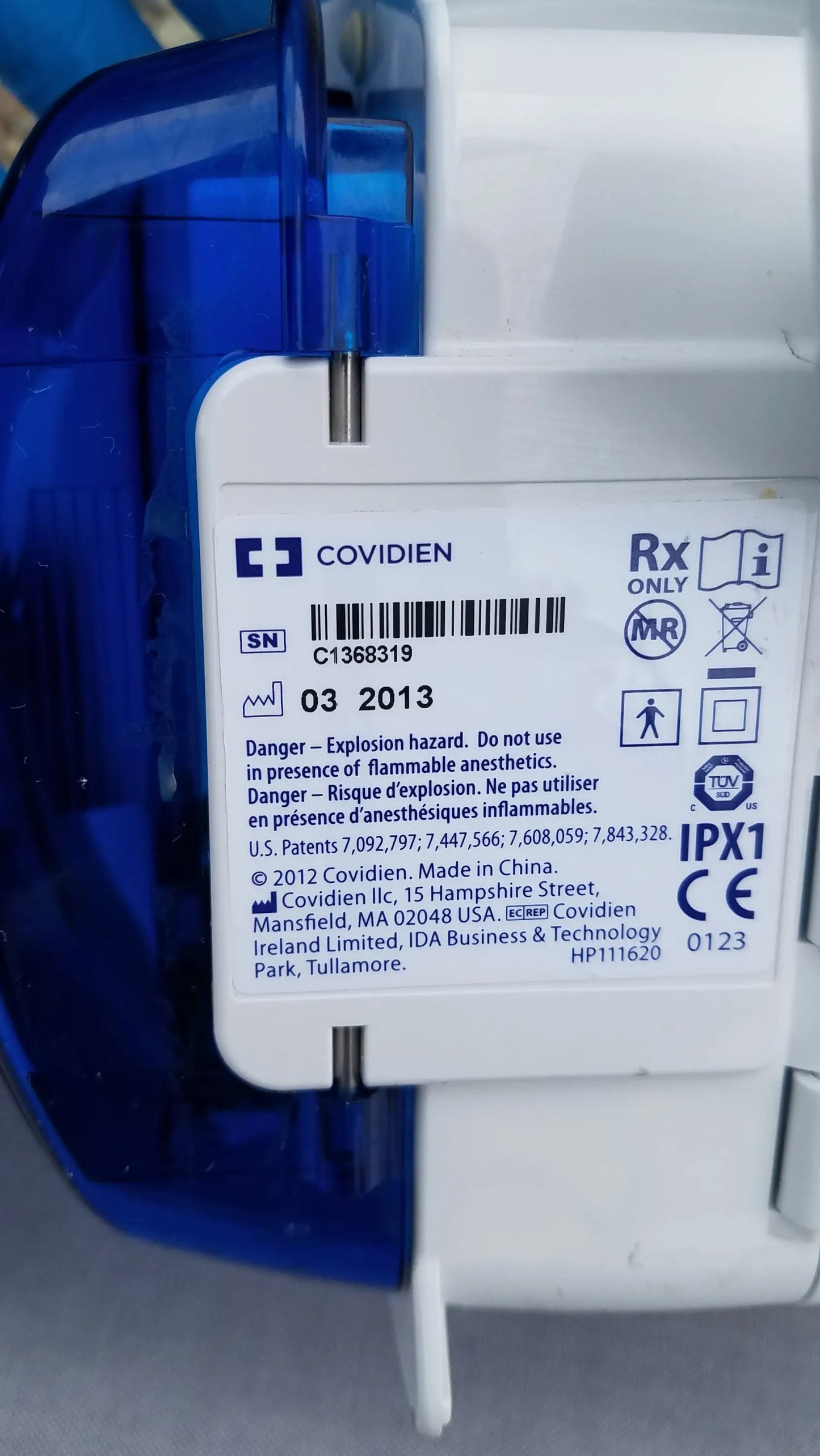 White plastic kangaroo epump enteral feeding pump with blue casing labeled covidien rx-only for compatible kangaroo use