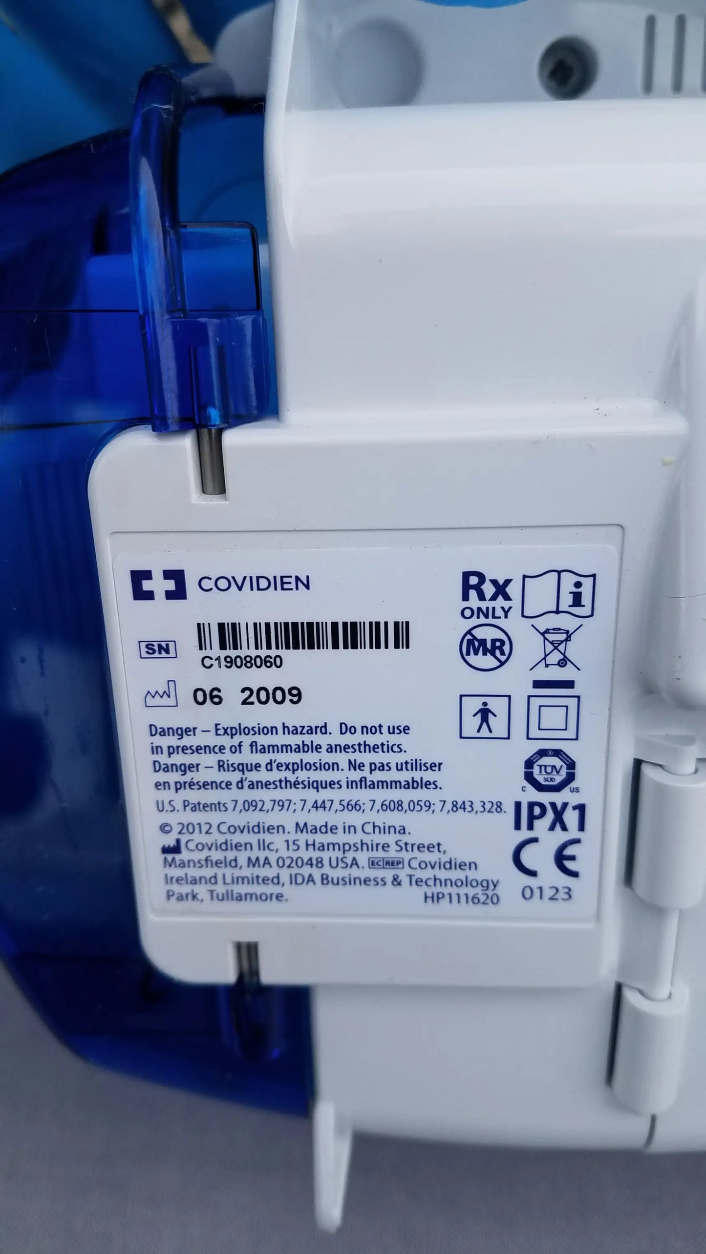White plastic kangaroo epump enteral feeding pump with blue translucent cover marked mri compatible by covidien