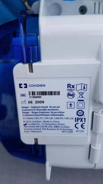 White plastic kangaroo epump enteral feeding pump with blue translucent cover marked mri compatible by covidien
