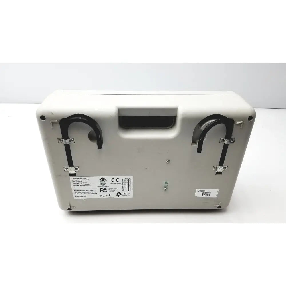 Off-white plastic low air loss mattress pump carrying case with black metal hooks and molded handle for easy transport