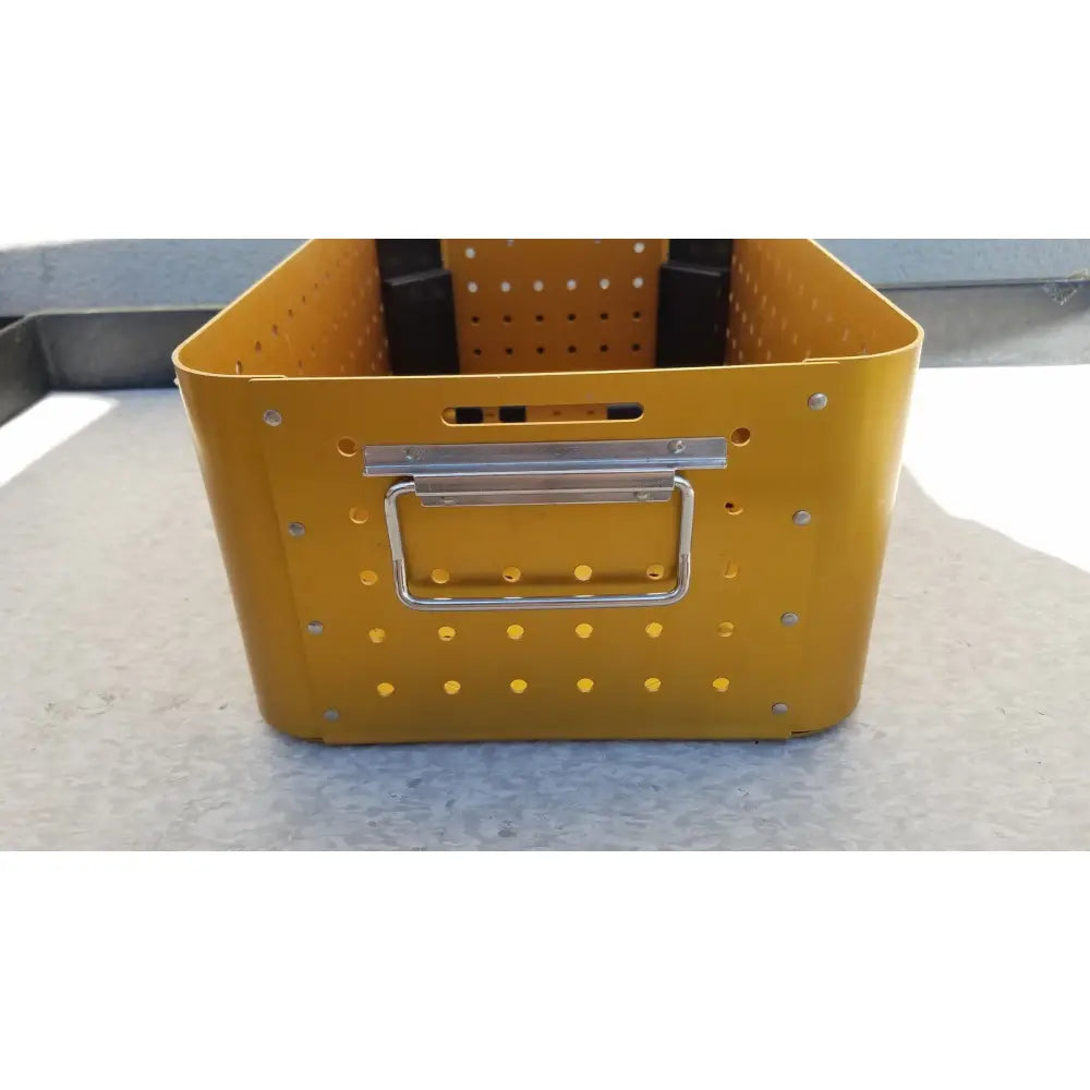 Yellow perforated metal diffuser housing perforator storage bin with silver handle for housing perforator driver empty case