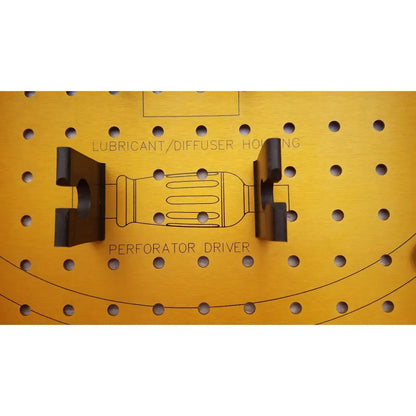 Black plastic diffuser housing perforator driver with rectangular body and two arms mounted on yellow pegboard