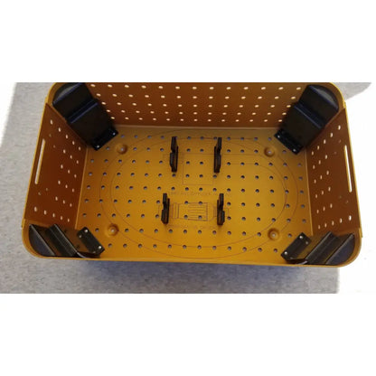 Yellow perforated plastic diffuser housing perforator basket with black corner supports and internal mounting brackets