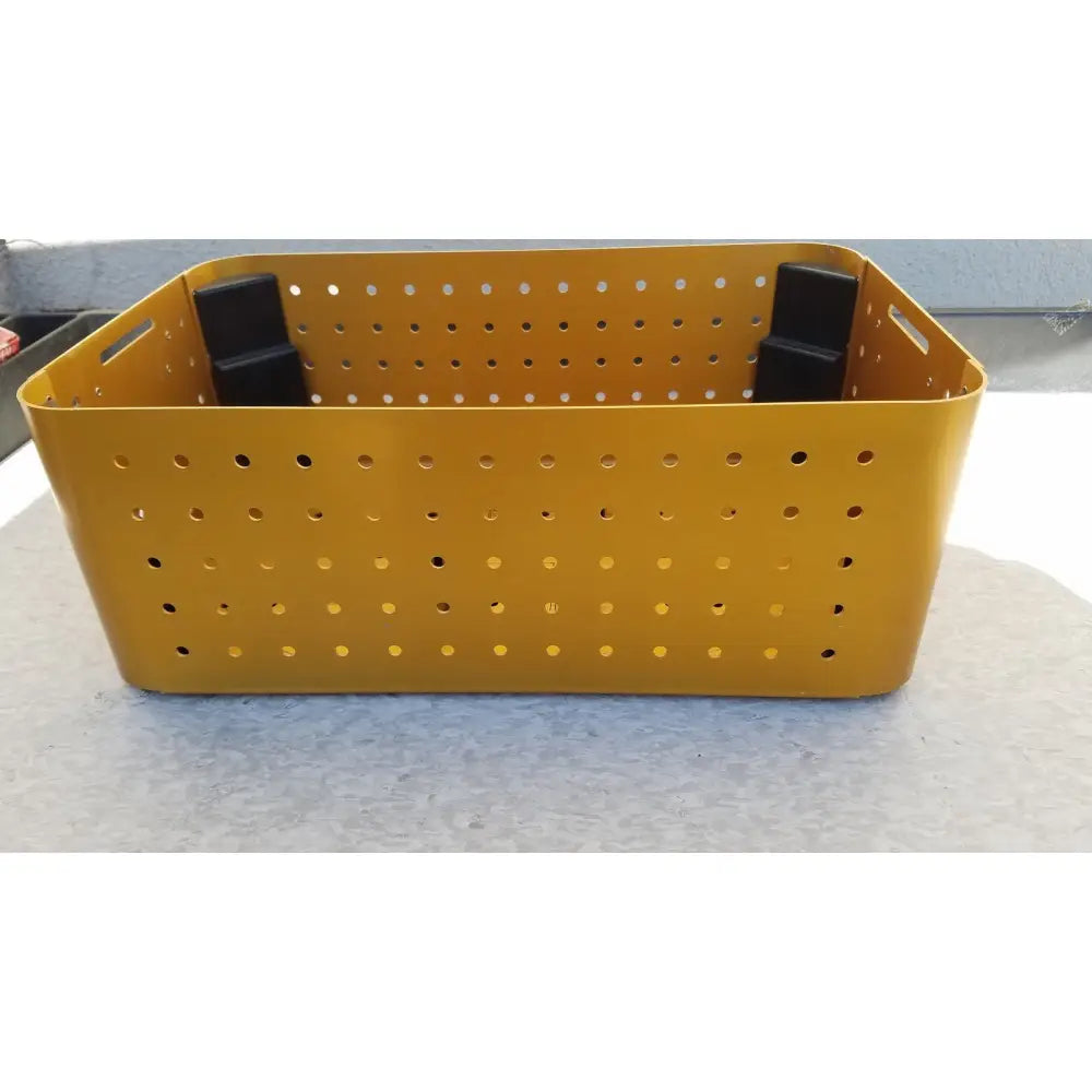 Yellow perforated plastic diffuser housing perforator driver storage bin with black handles empty case only