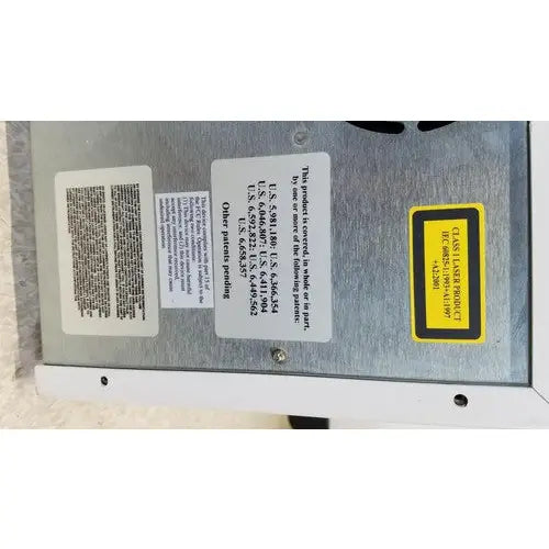 Silver metallic industrial laser engraver with class 1 yellow warning label on luminex 200 xmap multiplex ruo system