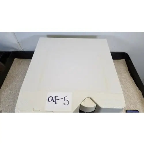 Off-white rectangular Luminex 200 xMap multiplex ruo system device with triangular cutout and handwritten af-5 label