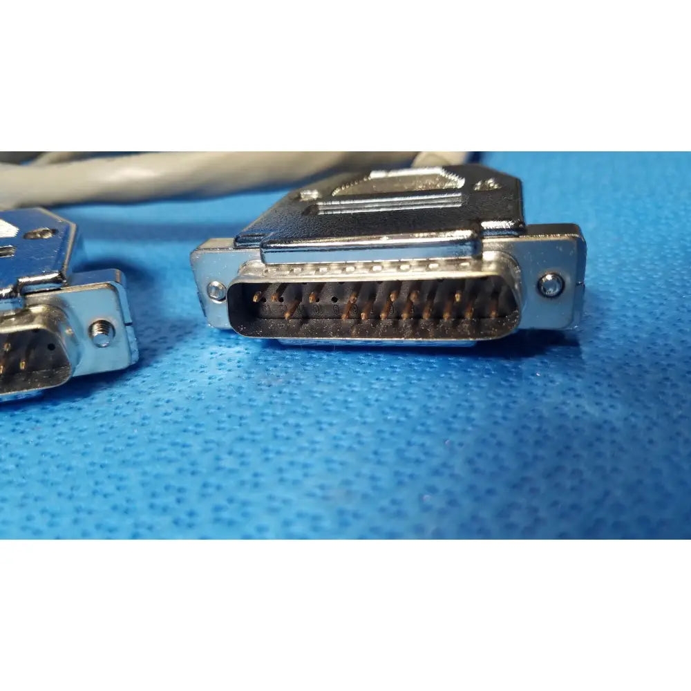 Silver-colored male pin connector d-sub data cable with metallic housing and multiple pins for secure connections