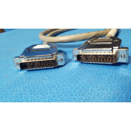 Two beige-coated male pin connector data cables with metallic db-25 male pin connectors for serial connection