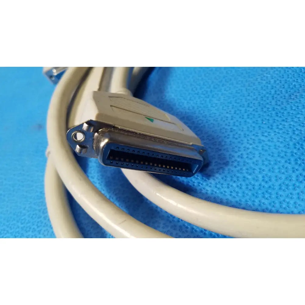 Beige male to female extension cable with d-sub connector, metallic housing, and black internal contacts for female extension use