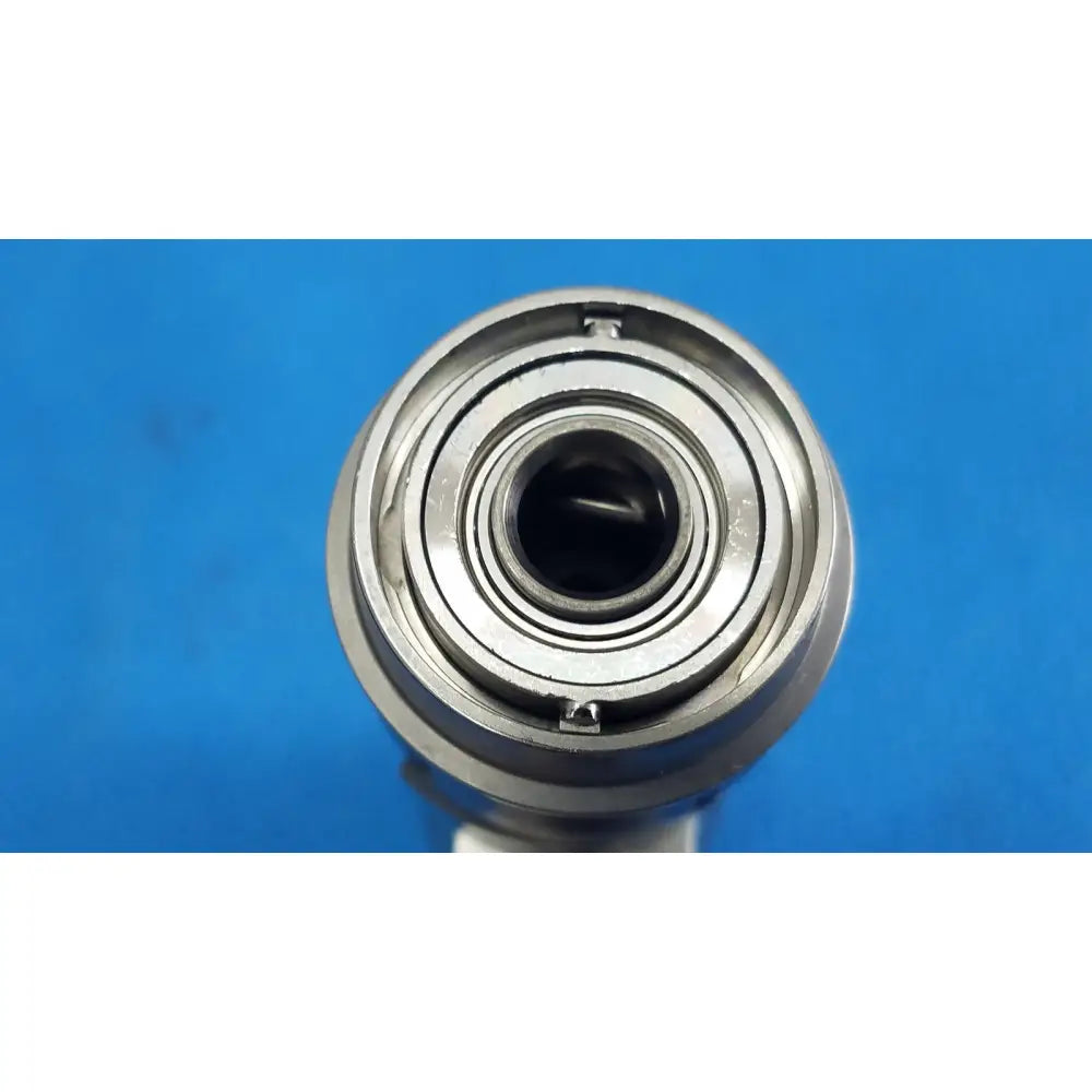 Silver-colored metal bearing with concentric rings and central hole for masimo patient cable 4ft medical use