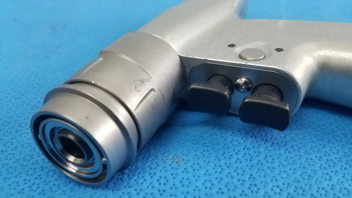 Silver-colored pneumatic impact wrench with black trigger and adjustment knobs shown alongside masimo lnc-04 patient cable 4ft