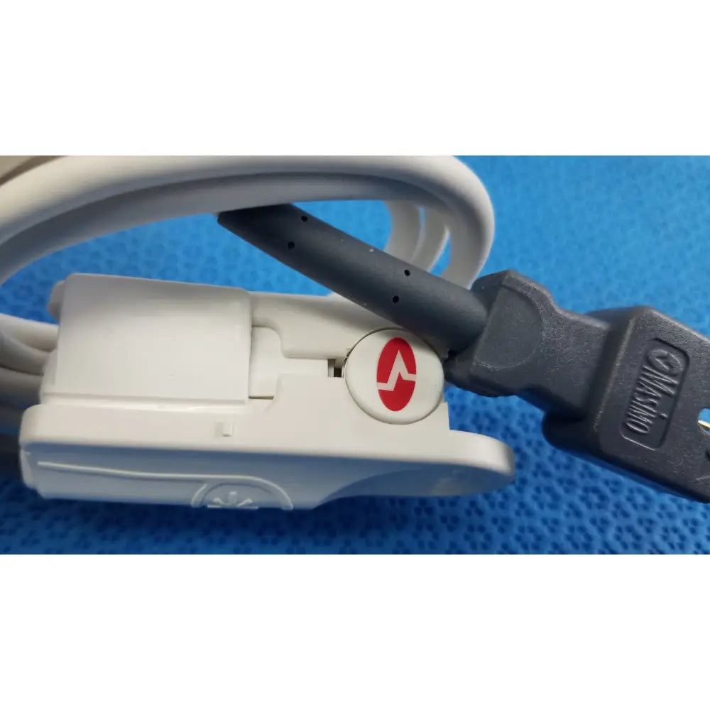 White plastic masimo lncs dci adult spo2 finger clip sensor with red logo gray cable connected to black usb plug