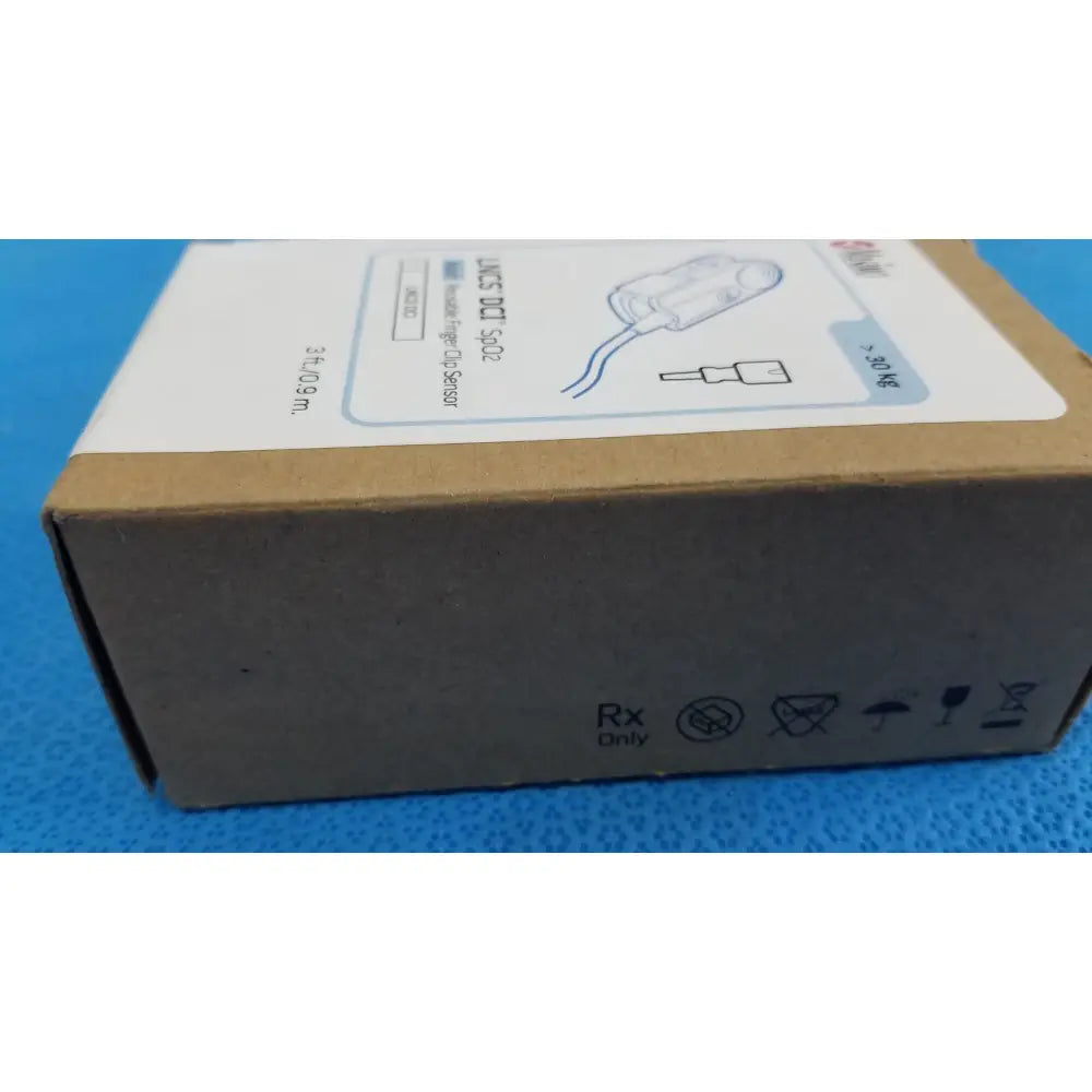 Brown cardboard box for masimo lncs dci adult spo2 finger clip sensor with product details and regulatory symbols