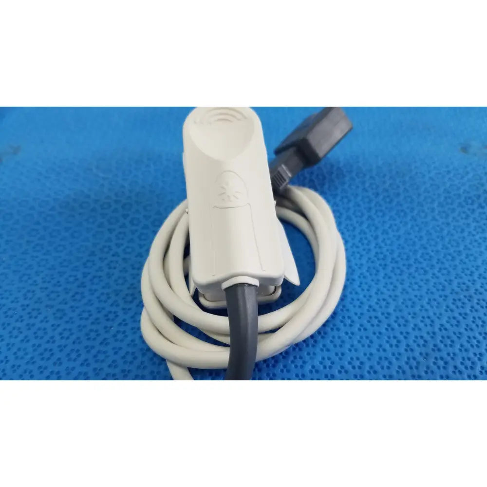 White plastic masimo lncs dci adult spo2 finger clip sensor with coiled cable and black connector for spo2 finger clip use