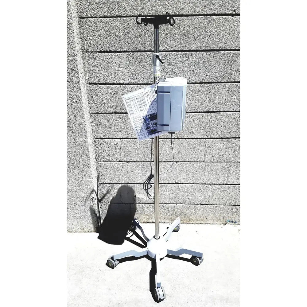 White masimo mridium 3600+ mri infusion pump monitoring system mounted on wheeled stand for pump monitoring systems