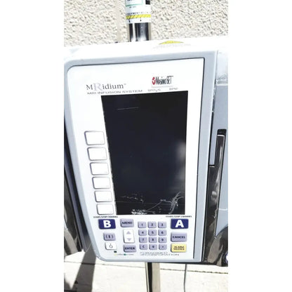 White masimo mridium 3600+ mri infusion pump monitoring system control panel with cracked screen and labeled buttons