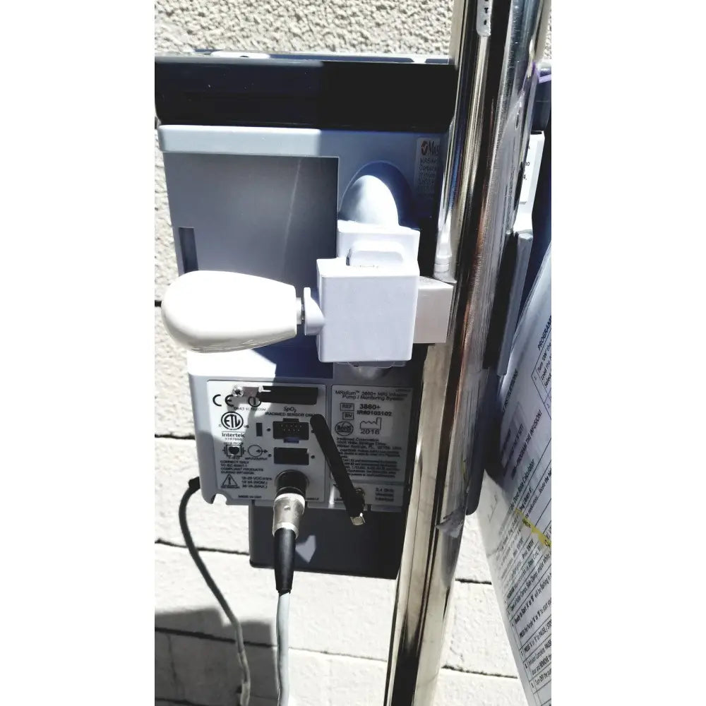 White plastic outdoor lighting fixture with curved lamp head used in masimo mridium 3600 plus mri infusion pump monitoring system